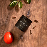 TERRA ELMNT Astaxanthin & Lycopene Supplement bottle on a wooden table