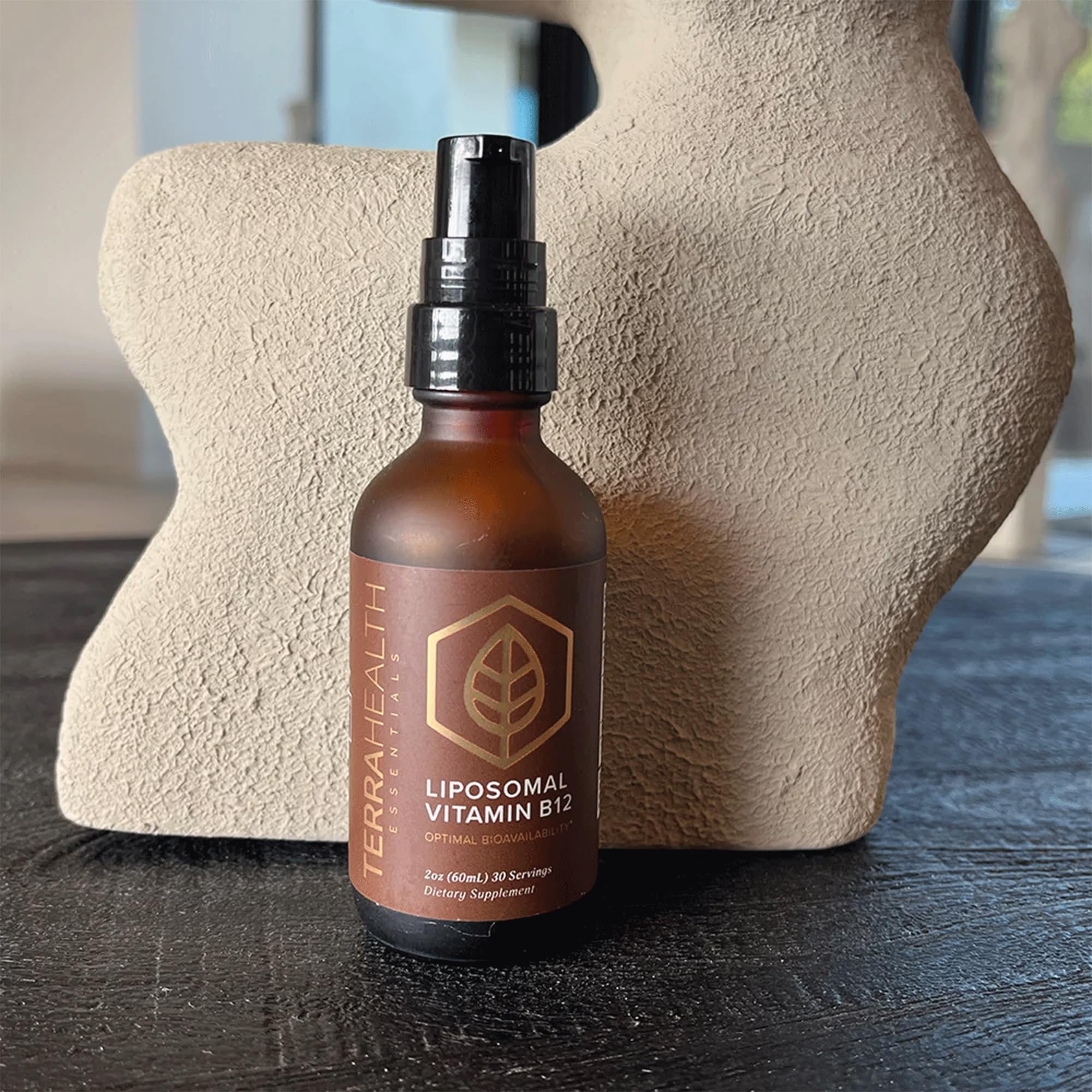 Terra Health Essentials Liposomal Vitamin B12 with a measuring spoon