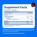 The Feel Great Vitamin Company Kids Melatonin Gummies 1mg Strawberry with a measuring spoon