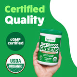 The Feel Great Vitamin Company Superfood Reds and Greens Powder in a glass