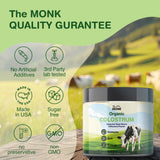 THE MONK Whole Colostrum Powder container with serving scoop