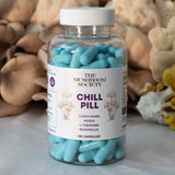 The Mushroom Society Herbal Supplement Capsules on a wooden table