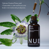 The Nue Co Sleep Drops 30ml bottle on a nightstand