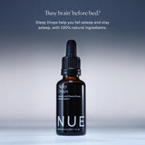 The Nue Co Sleep Drops with a glass of water