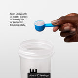 THORNE Creatine Monohydrate 299g lifestyle scene with fitness equipment