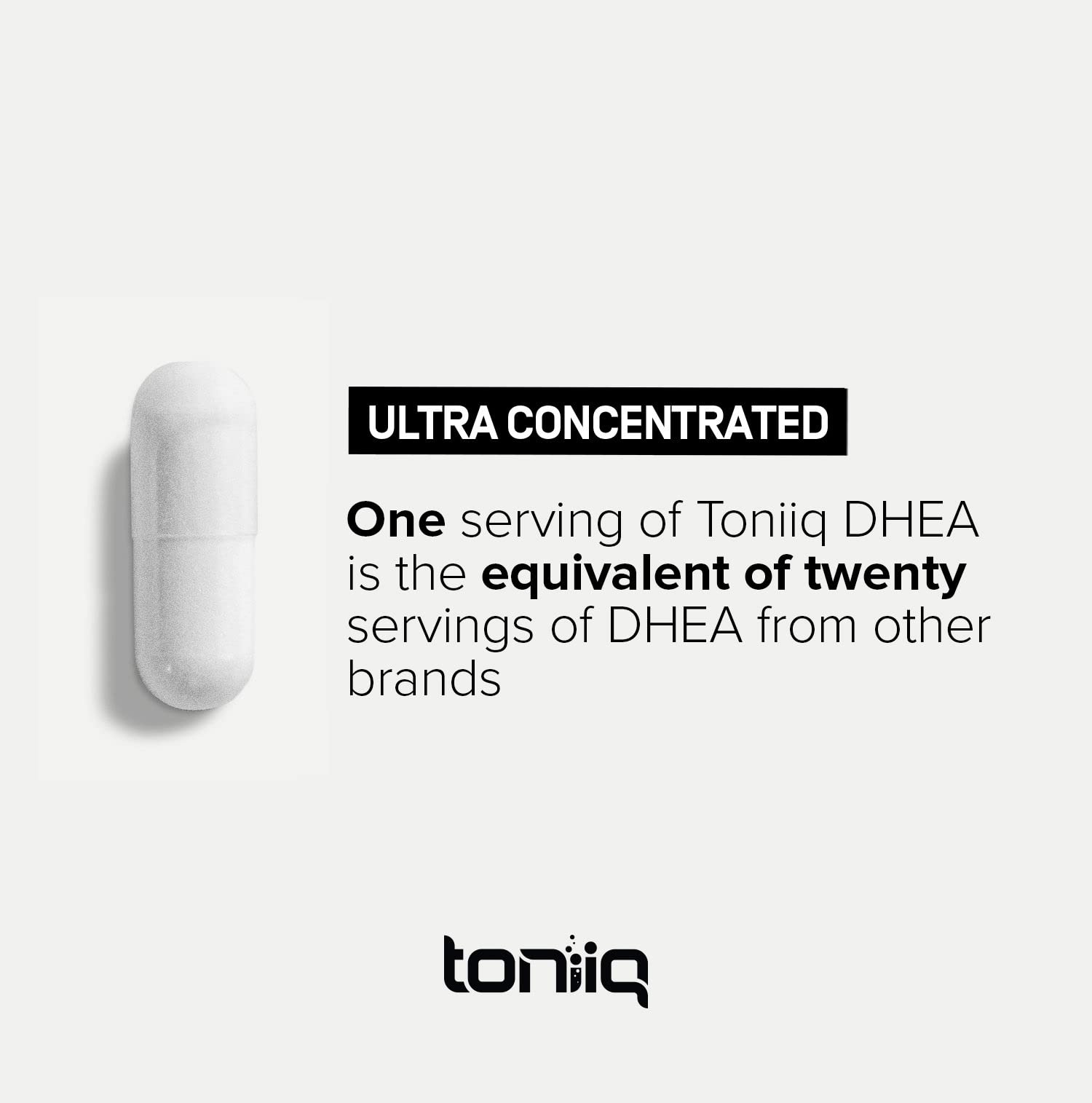 Toniiq DHEA 100mg supplement in hand for size comparison