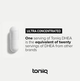 Toniiq DHEA 100mg supplement in hand for size comparison