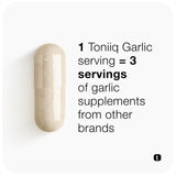 Toniiq Garlic Extract 1000mg capsules with a glass of water