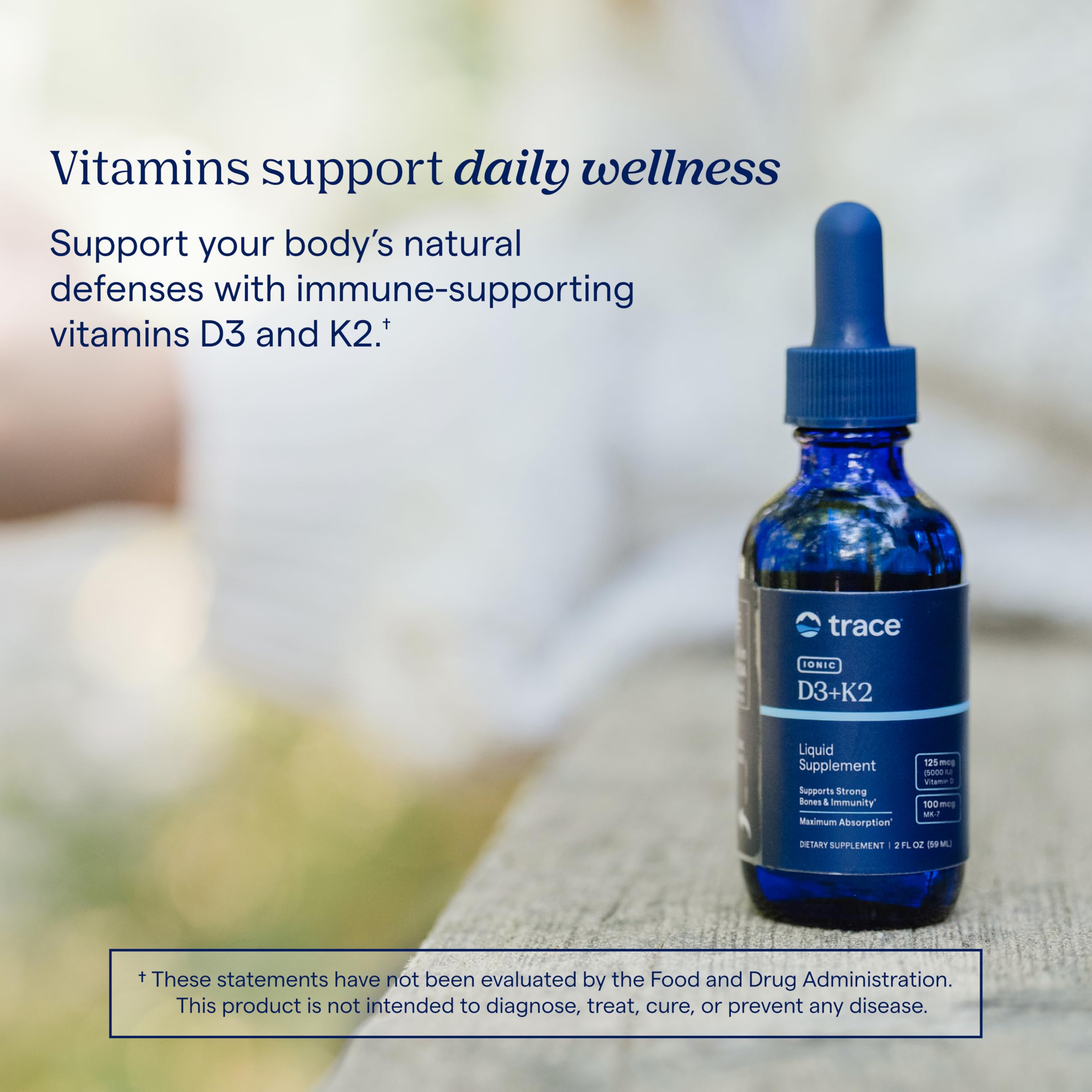 Trace Minerals Ionic D3 + K2 supplement on a wooden table