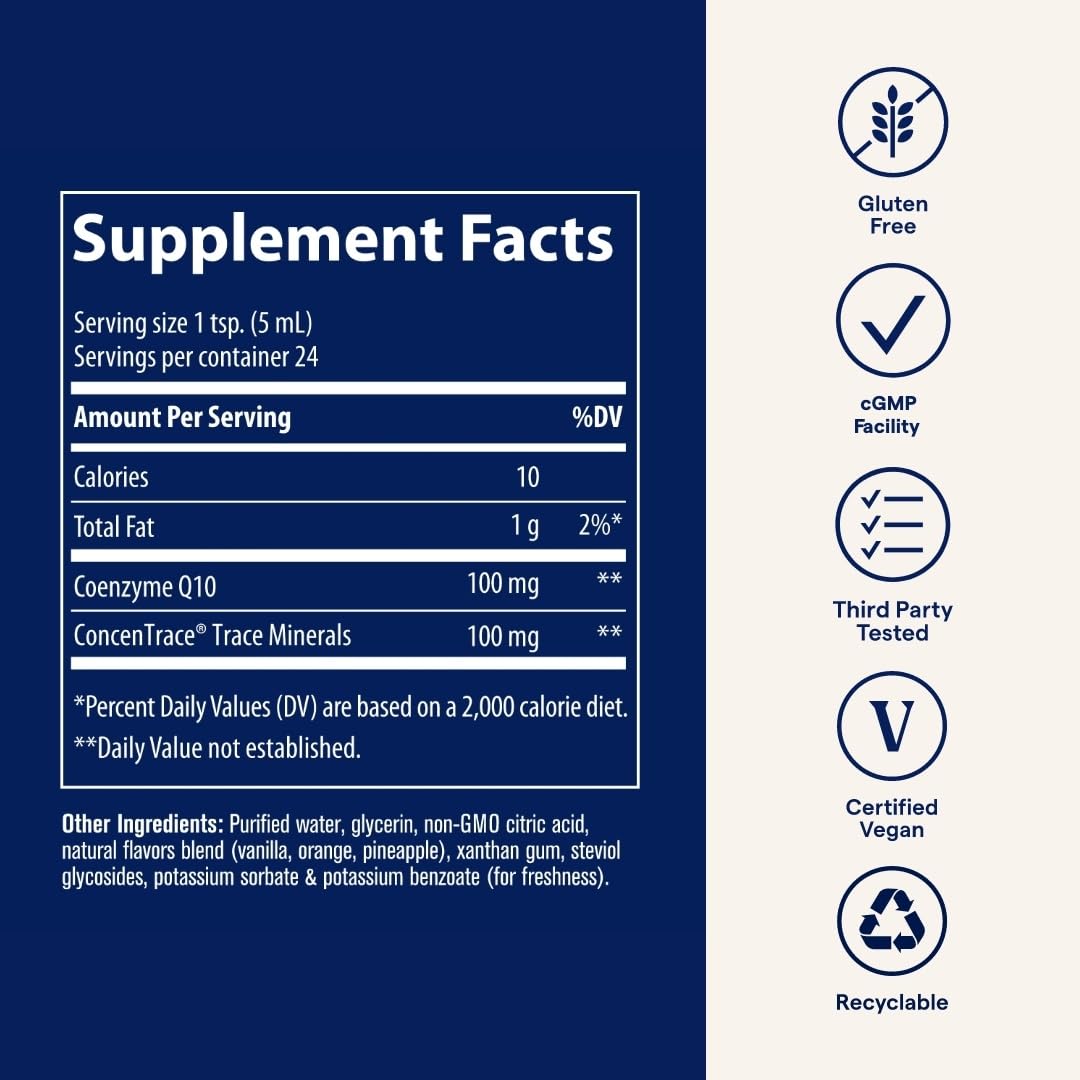 Trace Minerals Liquid CoQ10 100mg bottle on a wooden table