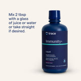 Trace Minerals Liquid daily wellness+ Mixed Berry with glass of juice