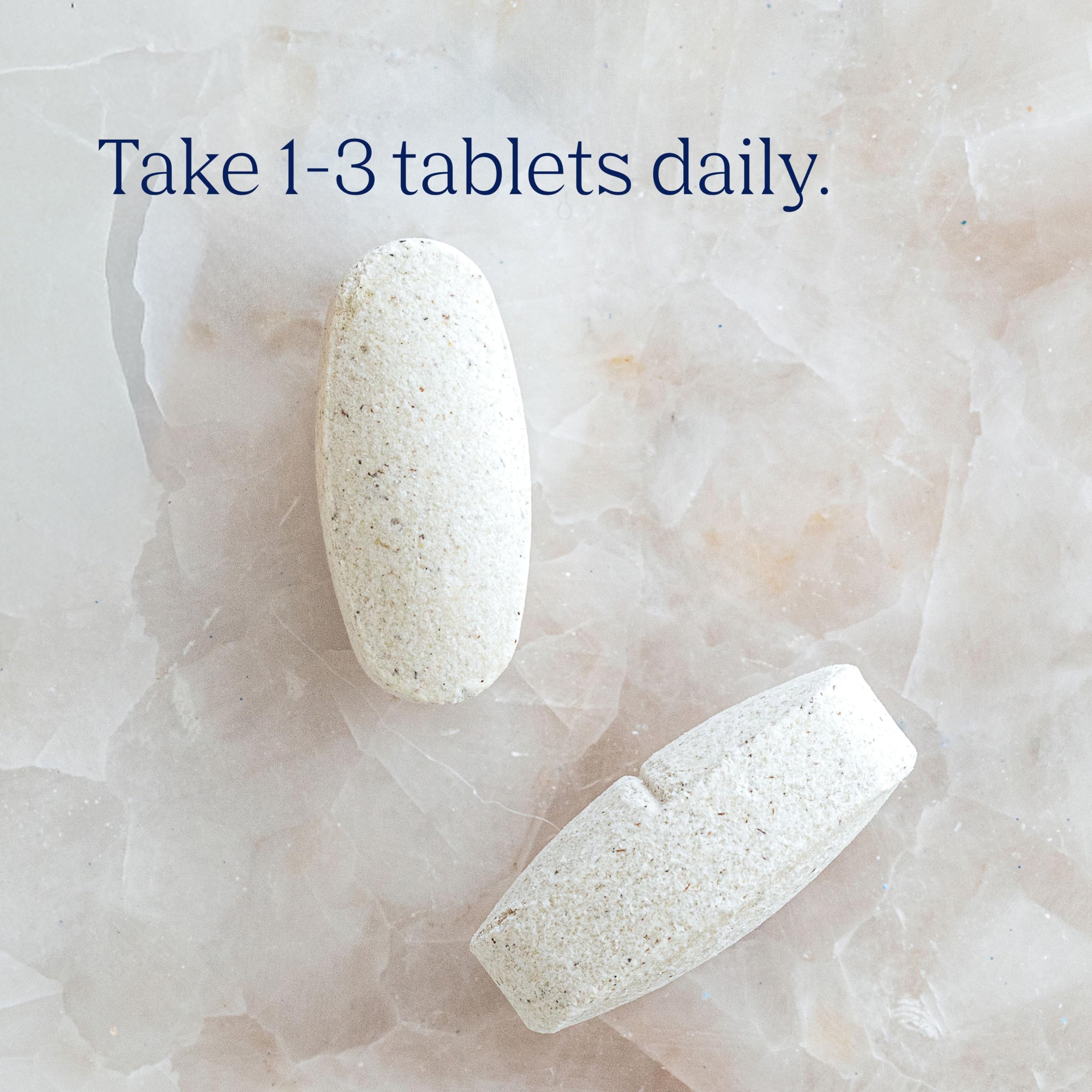 Trace Minerals Research ConcenTrace Trace Mineral Tablets with a glass of water