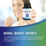 TRIO NUTRITION Magnesium Complex Capsules on a wooden table