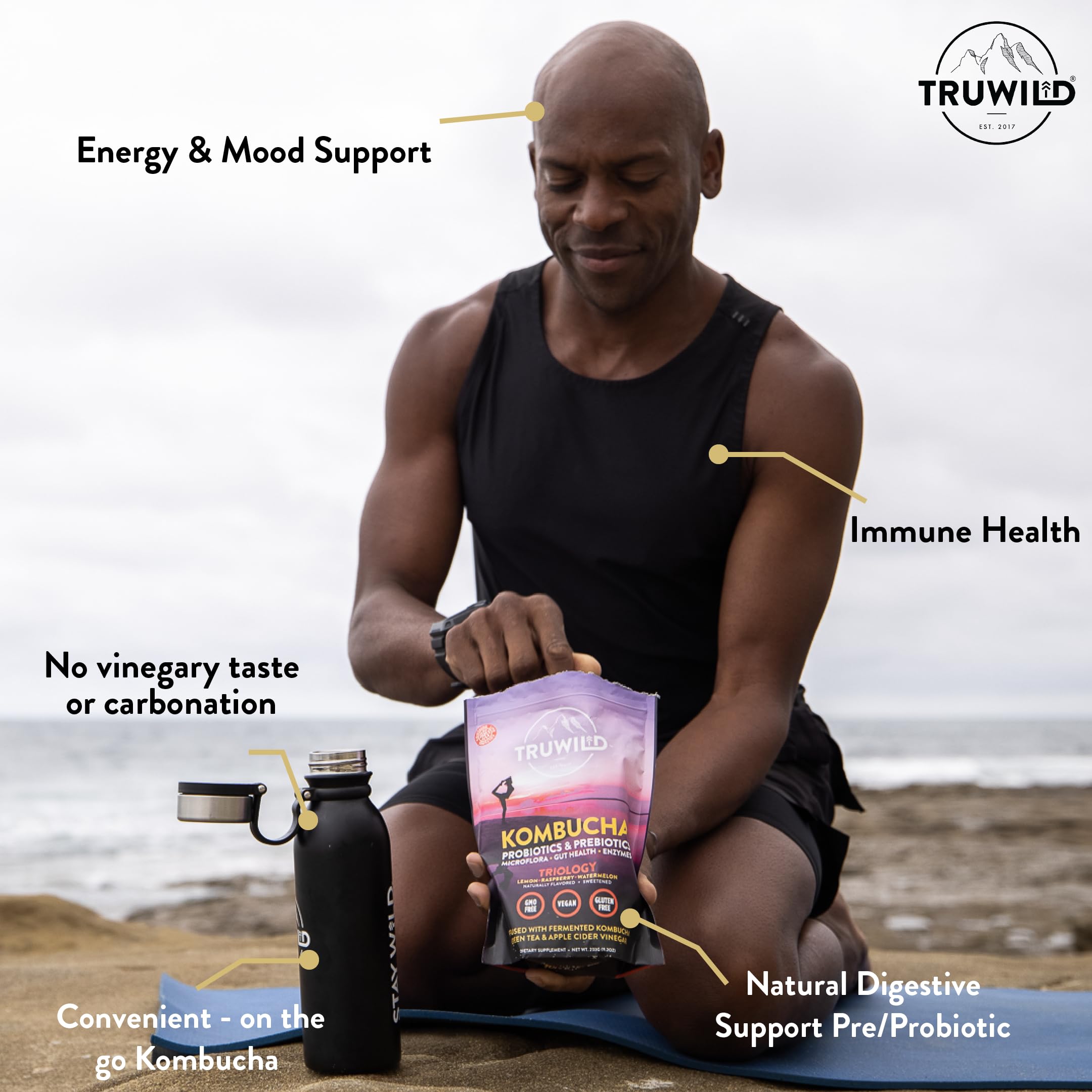 TruWild Kombucha Powder 227g mixed in a glass of water