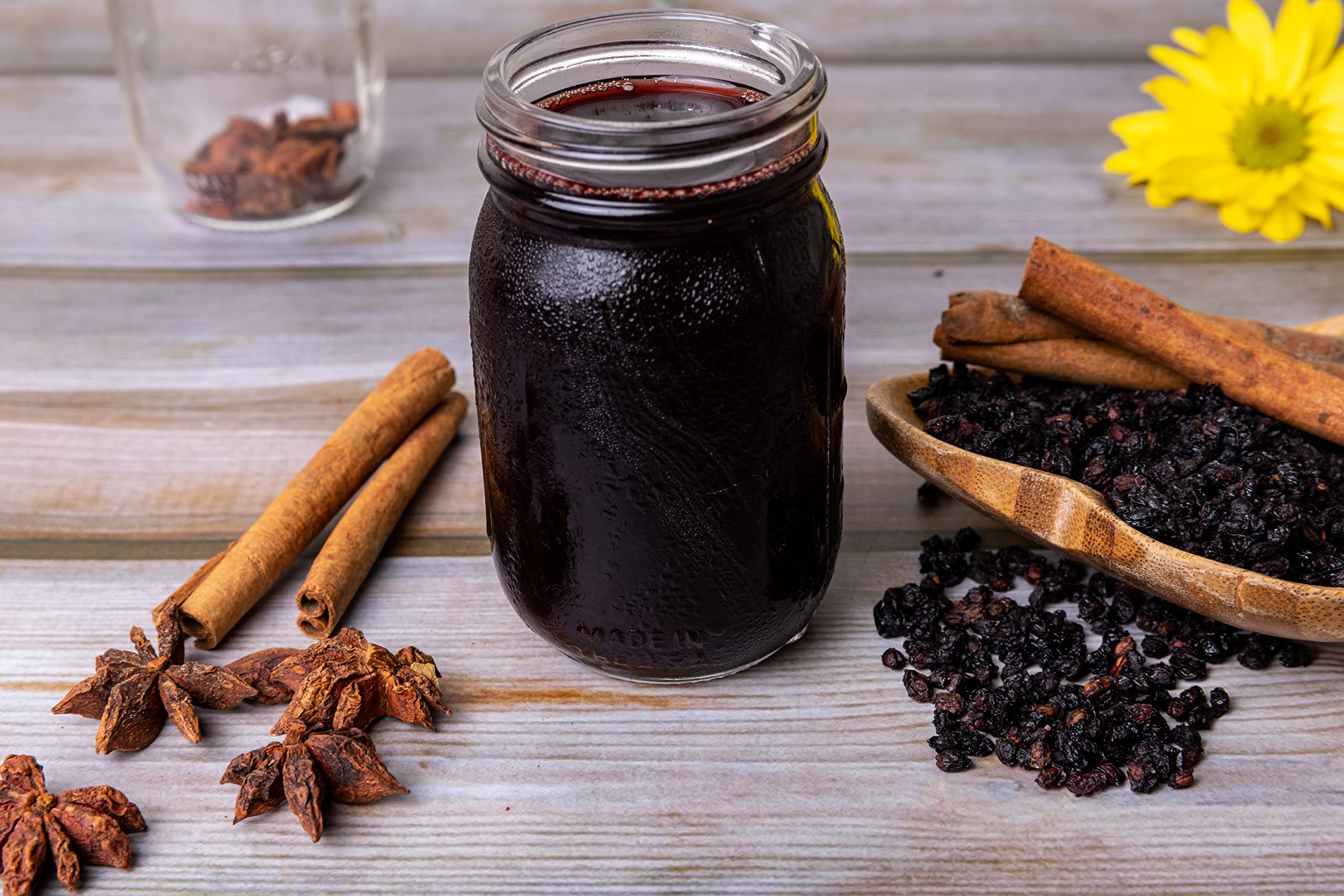 U.S. Wellness Naturals Organic Dried Elderberries on a wooden table