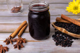 U.S. Wellness Naturals Organic Dried Elderberries on a wooden table