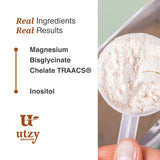 Utzy Naturals Magnesium Glycinate Sleep Supplement with a glass of water