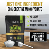 VELOMIX Creatine Monohydrate Powder in a glass of water
