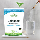 Vidanat Collagen Powder mixed in a glass of water