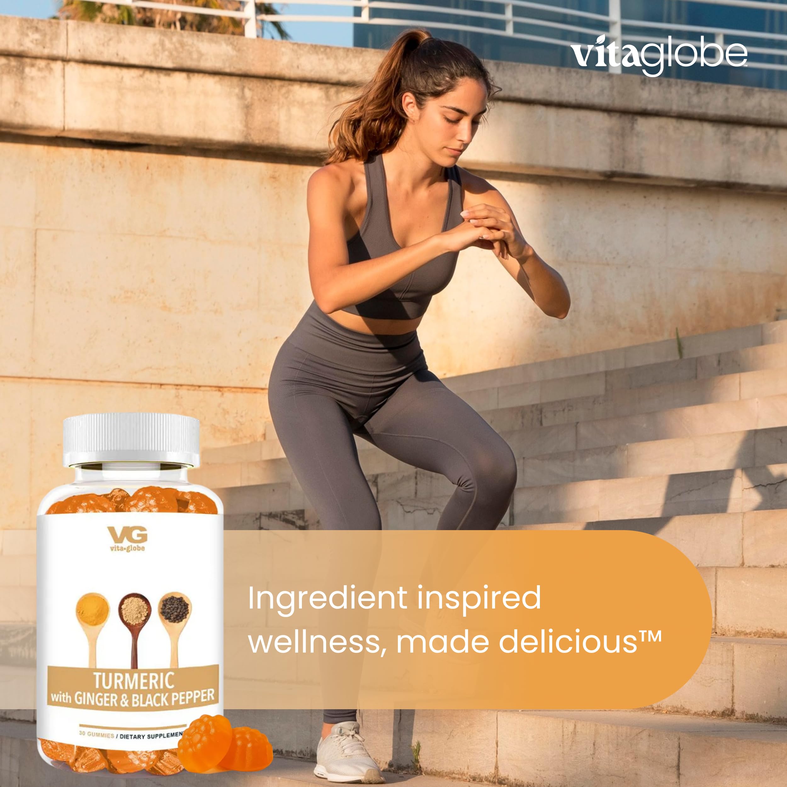 VITA GLOBE Turmeric Gummies lifestyle shot with a glass of water