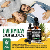 Vita Guard Magnesium Glycinate Liquid Supplement 500mg bottle with glass of water