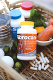 Vita Sciences Fibrocare supplement on a wooden table