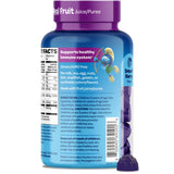 VITABURST Smurfs gummies with a child's hand