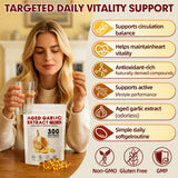 VitaCoeur Aged Garlic Extract Softgels on a wooden table