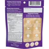 VitaDreamz Luna Berry Sleep Gummies with a glass of water