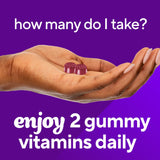 Vitafusion Extra Strength Biotin Gummies on a wooden table