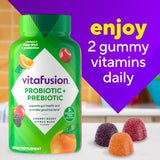 Vitafusion Fiber Well Gummies with fresh fruit background