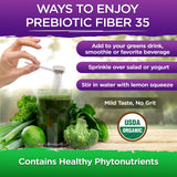 Vital Planet Prebiotic Fiber 35 Superfood Powder in a glass of water