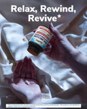 Vitalibre Magnesium Ashwagandha Complex 45g with a glass of water