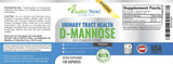 Vitalité Now! D-Mannose & Cranberry Extract capsules with a measuring spoon