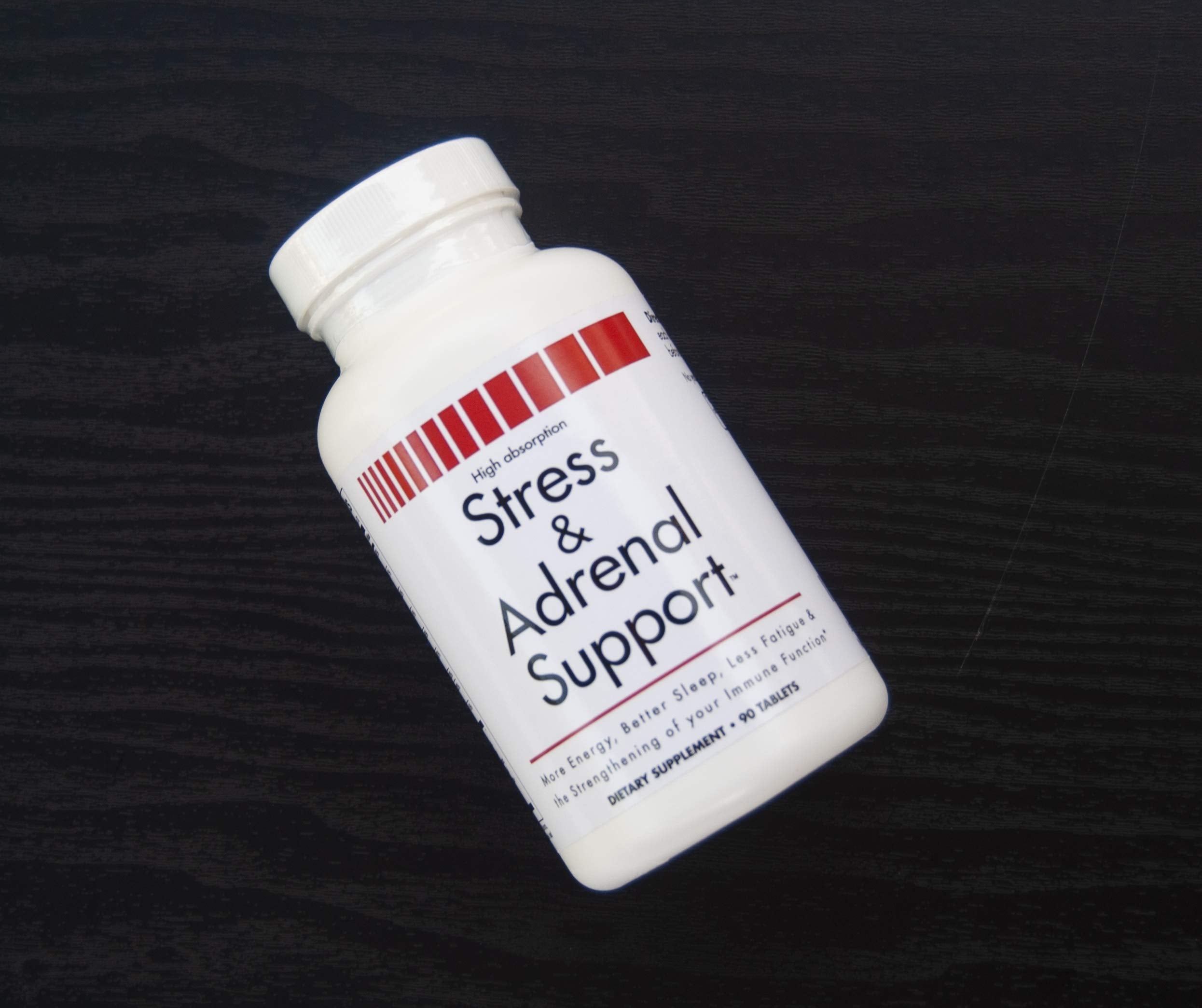 VitaminMed Stress and Adrenal Support chewable tablets in a hand