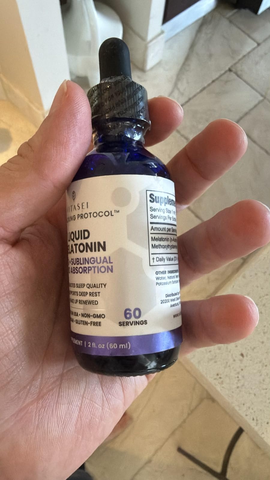 VITASEI Liquid Melatonin bottle with dropper in lifestyle setting