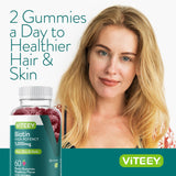 Viteey Biotin Gummies bottle with two gummies on a wooden table
