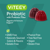 Viteey Prebiotic Gummies on a wooden table with berries