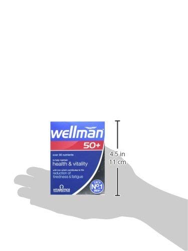 Wellman 50+ Multivitamin Tablets displayed on a wooden table