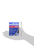 Wellman 50+ Multivitamin Tablets displayed on a wooden table