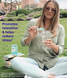 WellTaken daily wellness & De-Stress Drink Mix stick pack on a wooden table