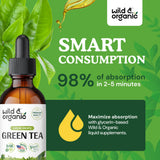 Wild & Organic Green Tea Extract Drops on a wooden surface