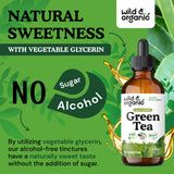 Wild & Organic Green Tea Extract Drops on a wooden table