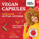 Wild & Organic Hawthorn Berry Capsules 1200mg capsules on a wooden surface