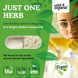 Wild & Organic Mastic Gum Capsules on a wooden surface