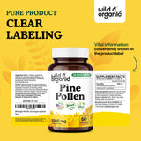 Wild & Organic Pine Pollen Capsules 1000mg on a wooden table