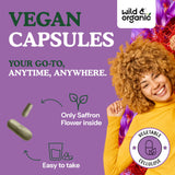 Wild & Organic Saffron Capsules bottle with capsules on a wooden surface