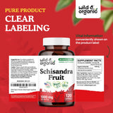 Wild & Organic Schisandra Capsules 1000 mg on a wooden surface