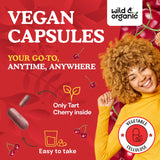 Wild & Organic Tart Cherry Capsules on a wooden table