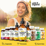 Wild & Organic Turmeric Ginger Black Pepper Supplement on wooden table